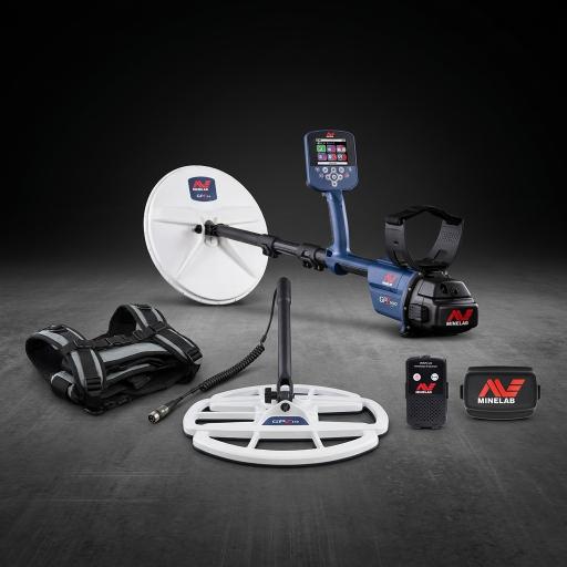 Minelab metal detector with accessories on a dark background